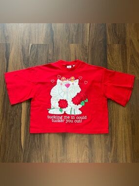 Vintage cropped tee with funny graphic ”tucking me in could tucker you out”